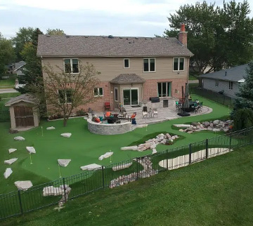 Outdoor synthetic grass putting green at house in florida