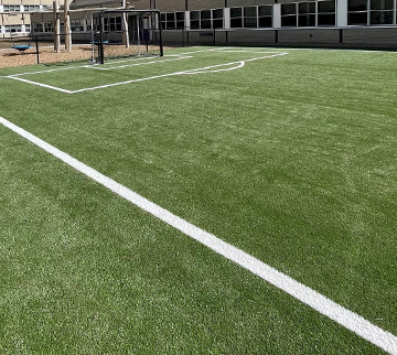 backyard soccer field with turf installed