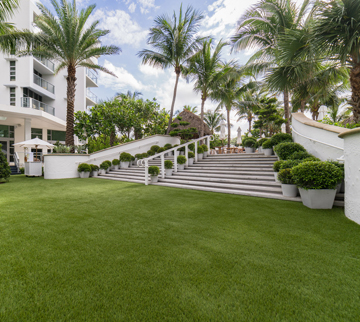 Synthetic grass lawn installed outside a hotel