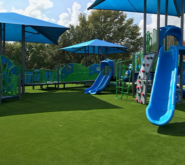Commercial playground with turf surfacing