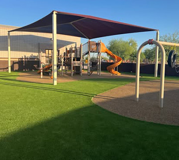 Commercial playground with turf surfacing