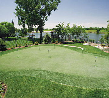 Outdoor synthetic grass putting green in Texas yard
