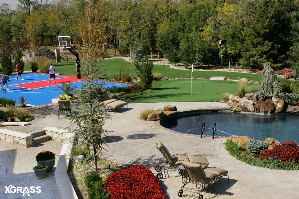 Backyard space with multi-sport game court and putting green