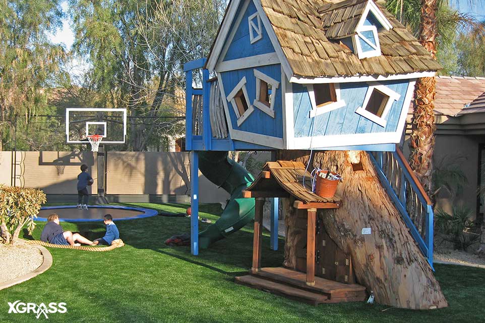 Backyard playground with safe and durable turf flooring