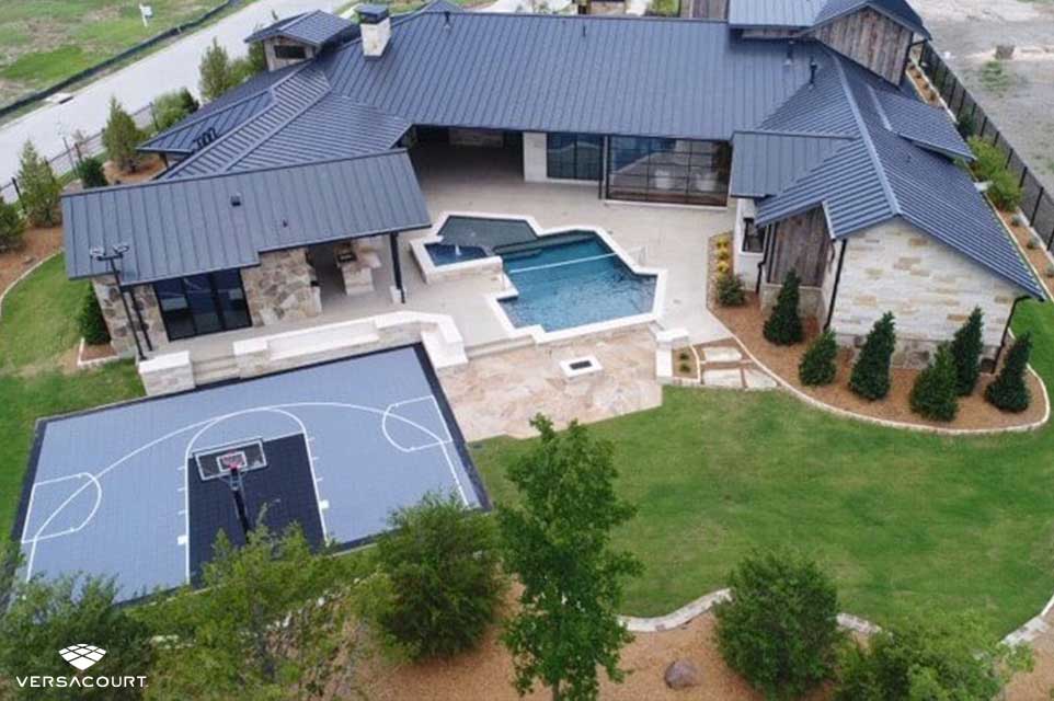 Big backyard with swimming pool and half court basketball court