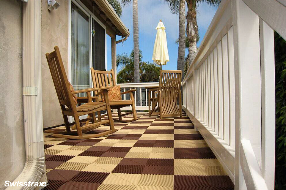 Tan modular floor tiles installed on a backyard porch
