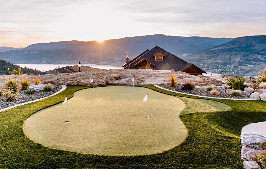 Artificial grass putting green in back yard overlooking mountains